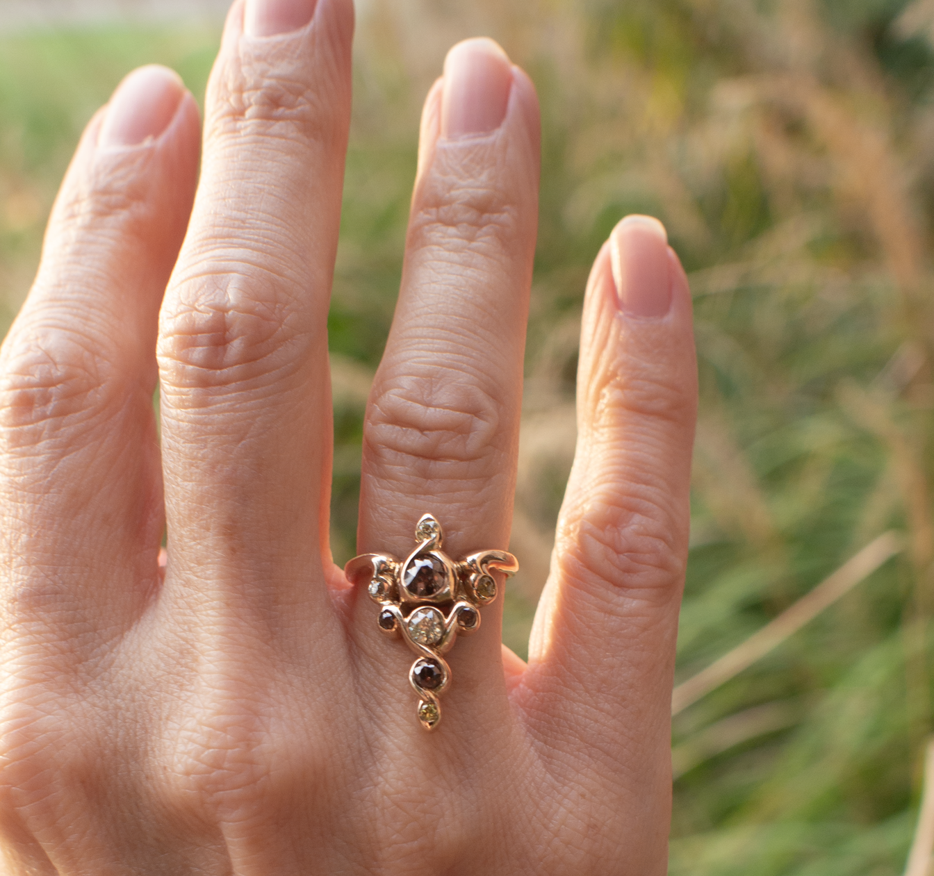 Art Nouveau Caduceus-styled vintage gold and colored diamond ring