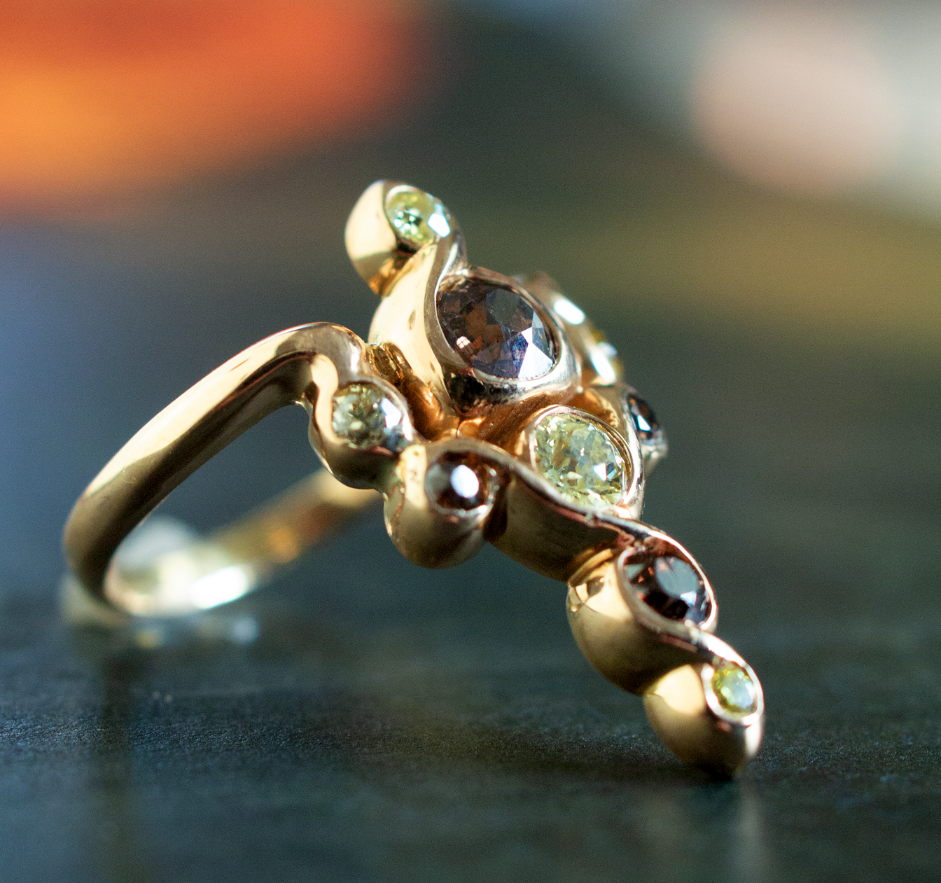 Art Nouveau Caduceus-styled vintage gold and colored diamond ring